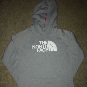 A small gray North Face sweatshirt